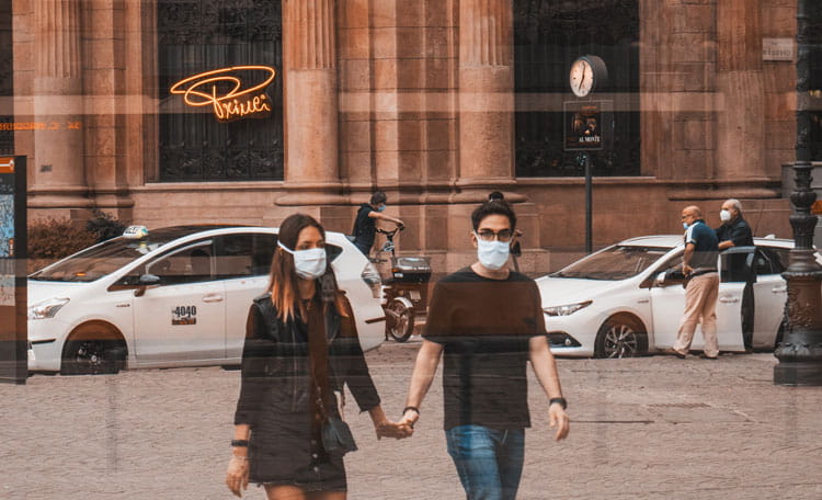 couple with face masks on Milan street