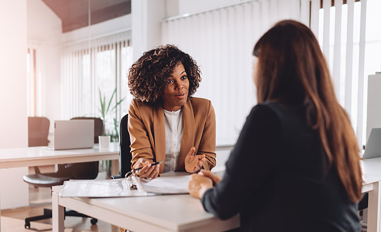 Women talking in an office