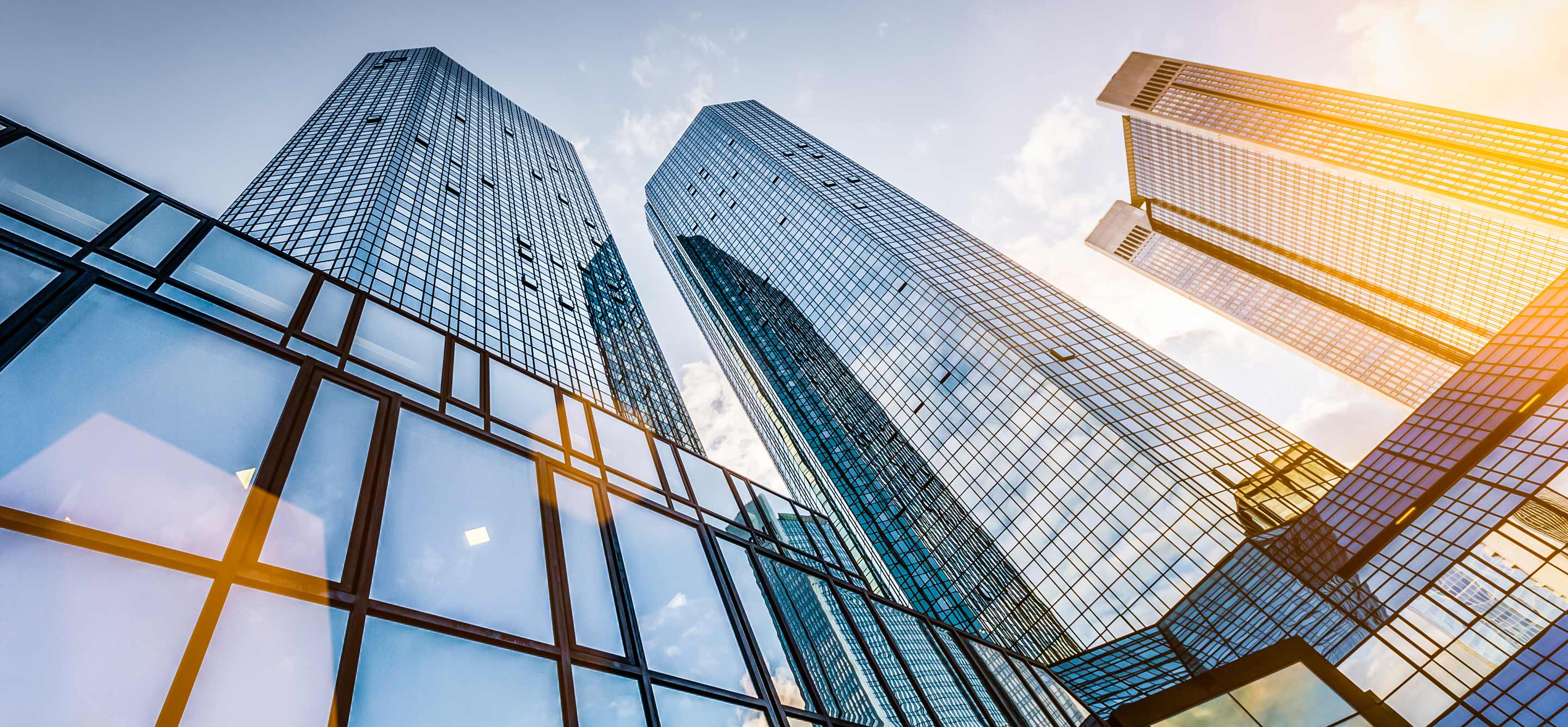 Three skyscrapers with glass windows