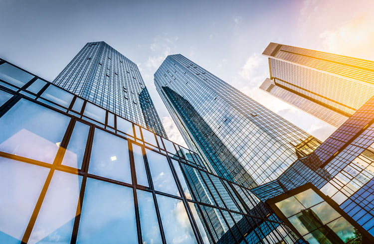 Three skyscrapers with glass windows